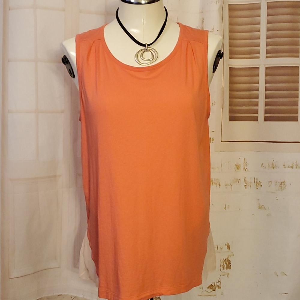 Sleeveless top by Calvin Klein.